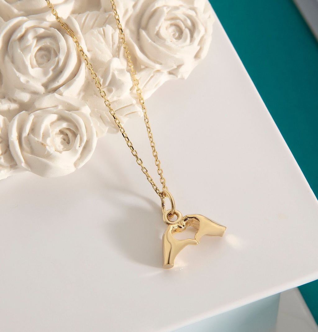 Gold Heart Hand Gesture Pendant
