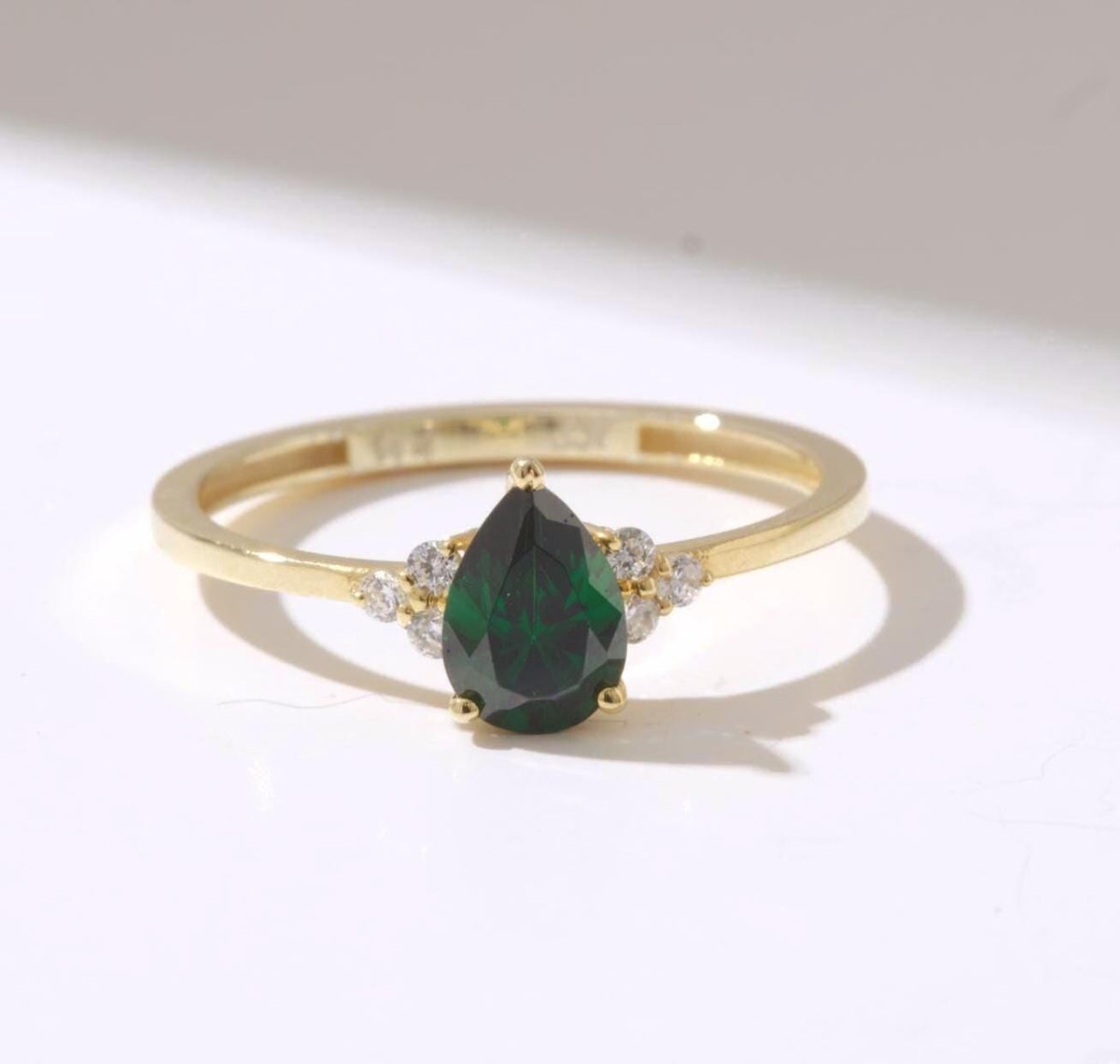 Pear Cut Side Stone Gold Birthstone Ring