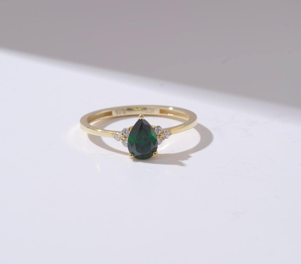 Pear Cut Side Stone Gold Birthstone Ring