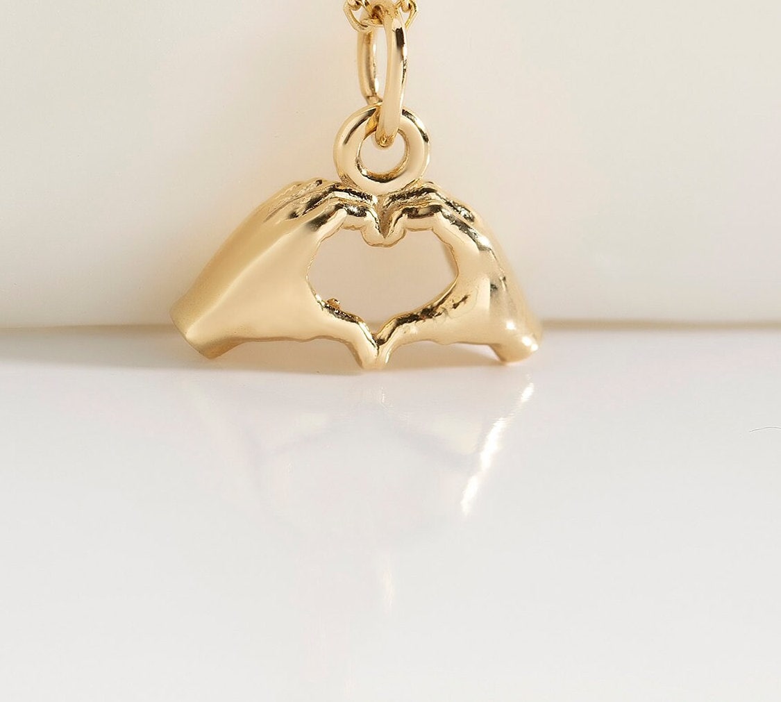 Gold Heart Hand Gesture Pendant