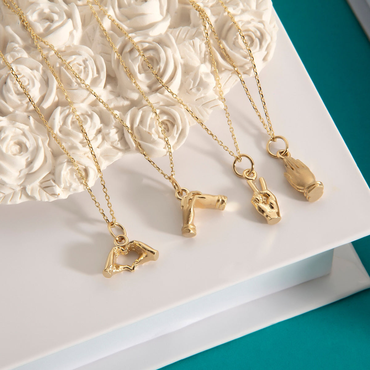 Gold Holding Hands Pendant