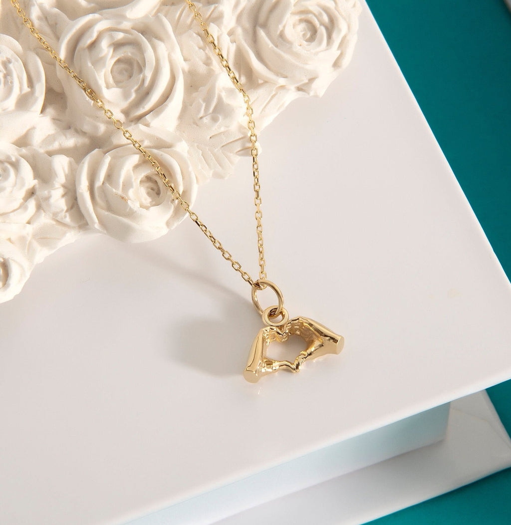 Gold Heart Hand Gesture Pendant